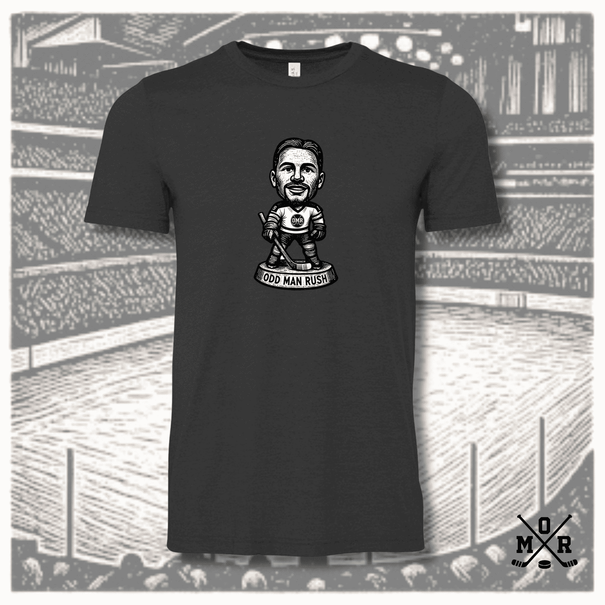 Charcoal grey t-shirt featuring odd man rush hockey bobblehead graphic on arena background