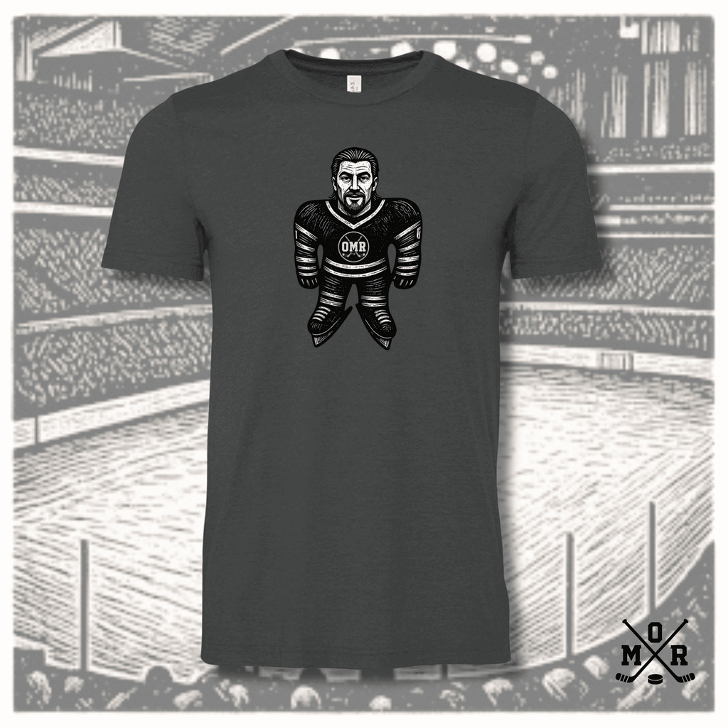Vintage hockey plush t-shirt in dark heather charcoal with woodcut graphic of player