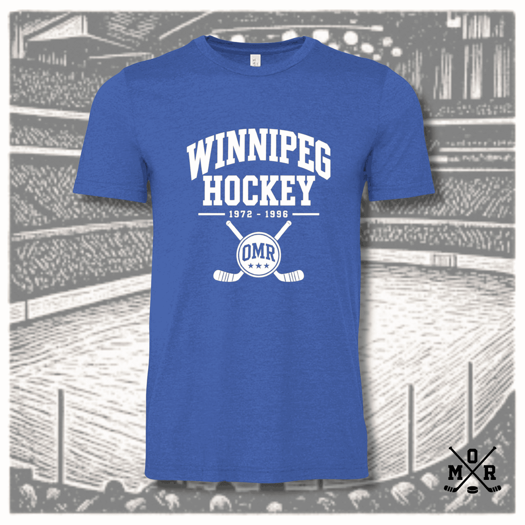 Heather royal blue Winnipeg Hockey vintage t-shirt with white arched text and crossed sticks crest